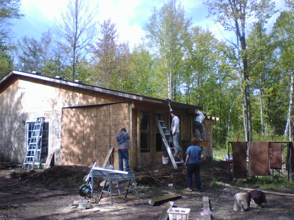 Camp construction. Learning carpentry, roofing, siding...
