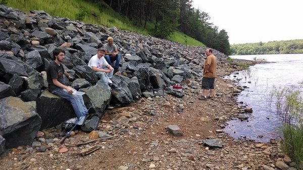 wvt camp guys along river fishing